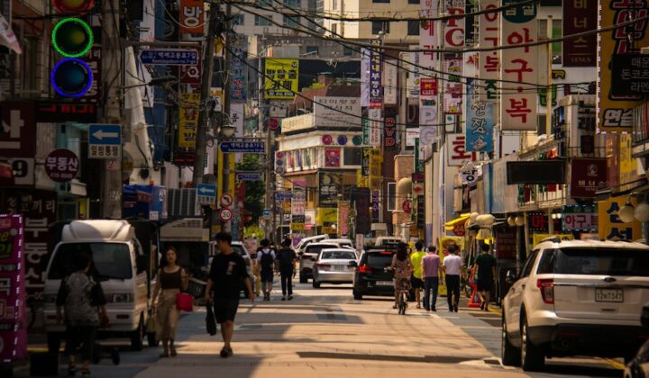 People walking along a busy street in Seoul, South Korea