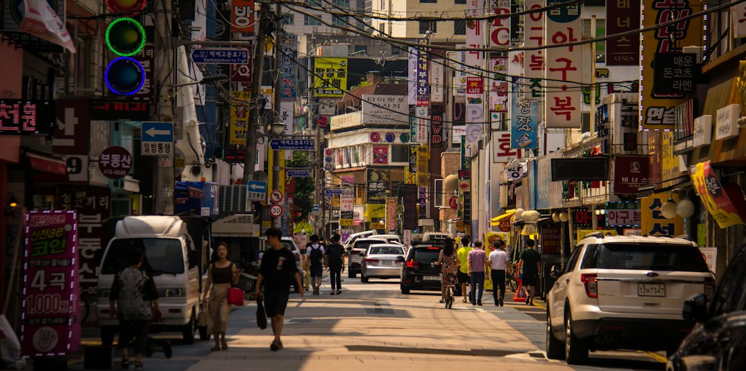People walking along a busy street in Seoul, South Korea