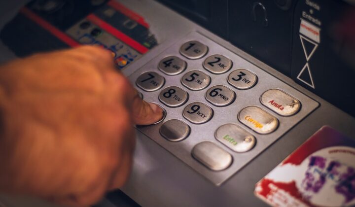 Person using an ATM, representing everyday banking in Korea