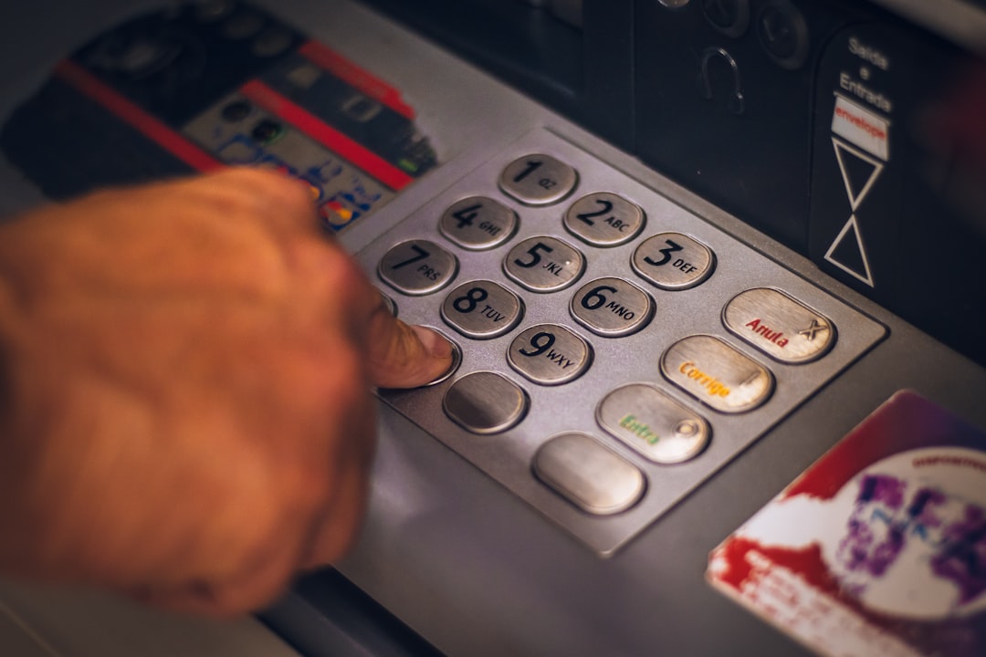 Person using an ATM, representing everyday banking in Korea