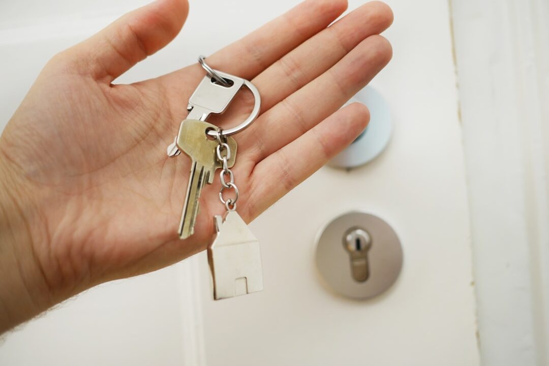 Apartment keys and lease paperwork representing Wolse and Jeonse rental contracts